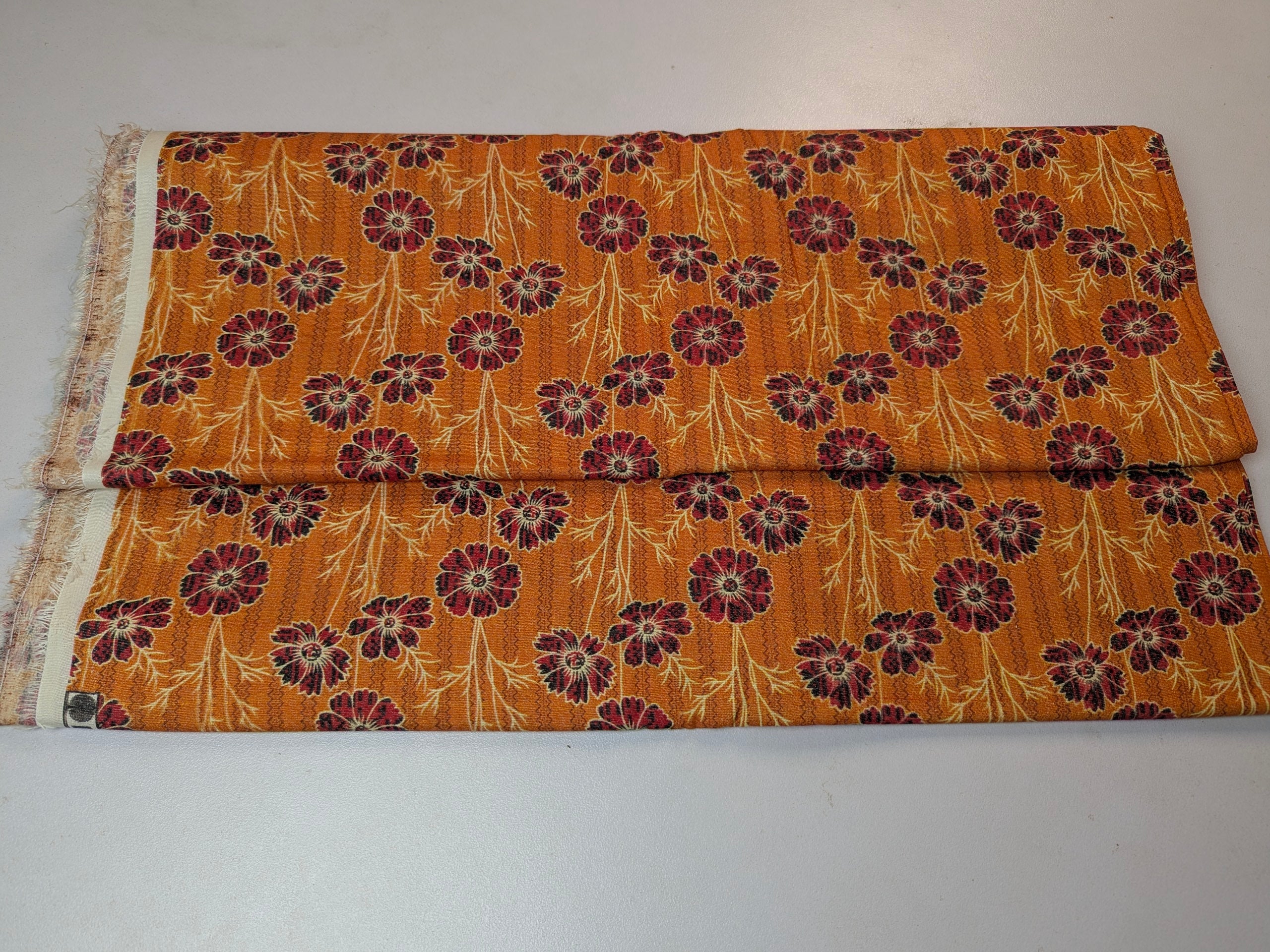 Folded fabric with floral pattern on a white background