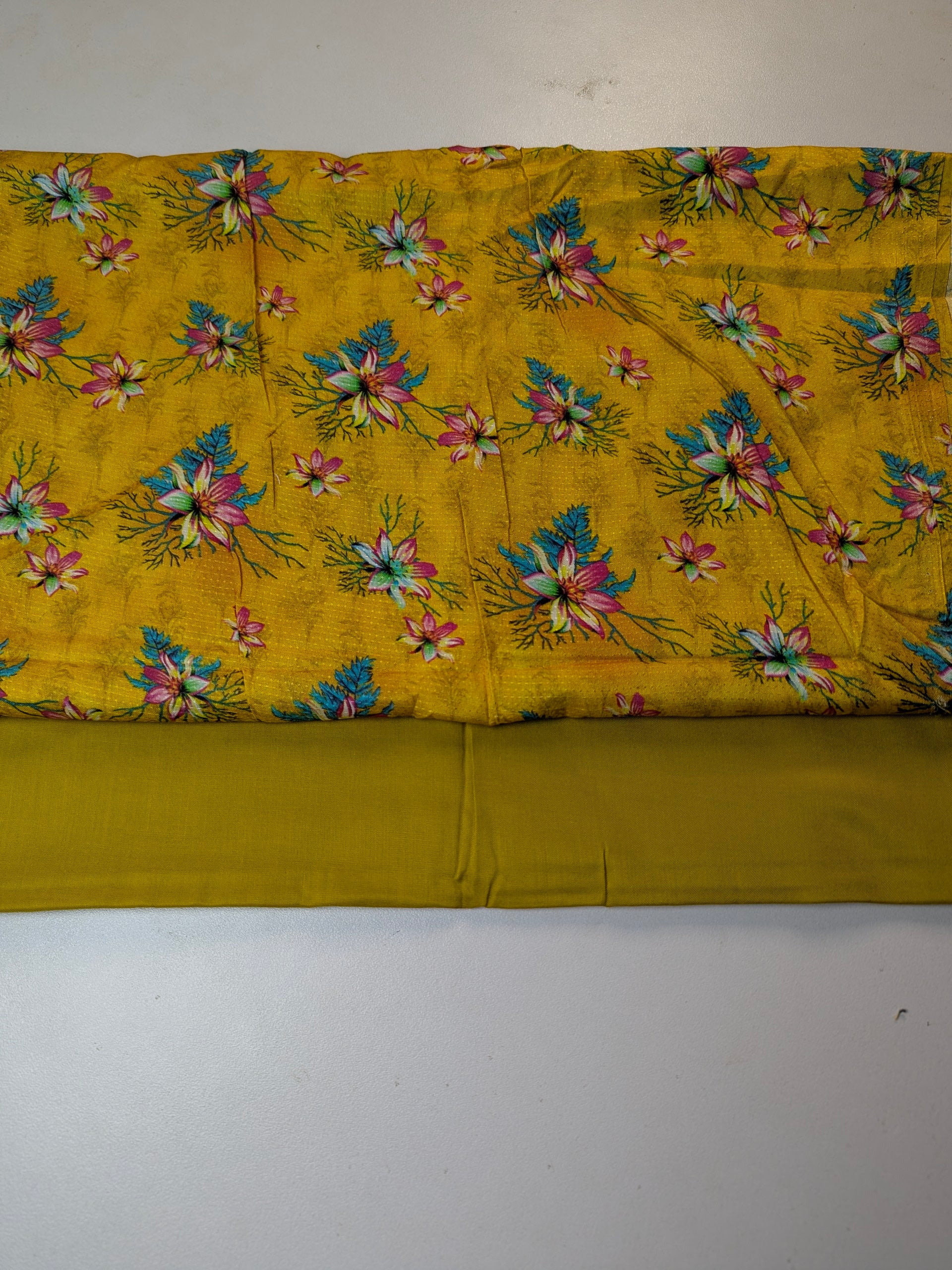 Yellow fabric with floral pattern on a white background