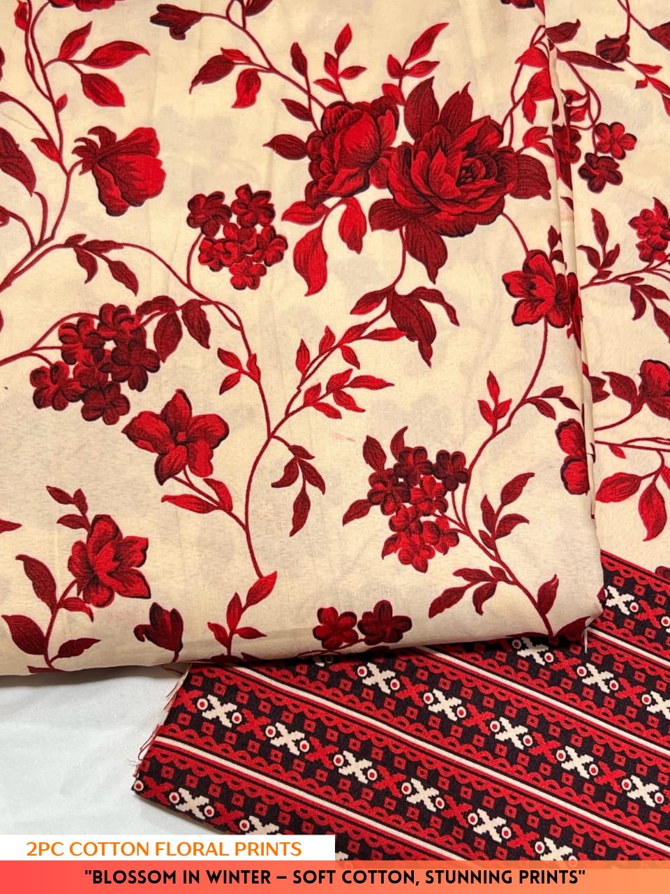 Roll of red floral fabric on a white background with text about cotton floral prints.